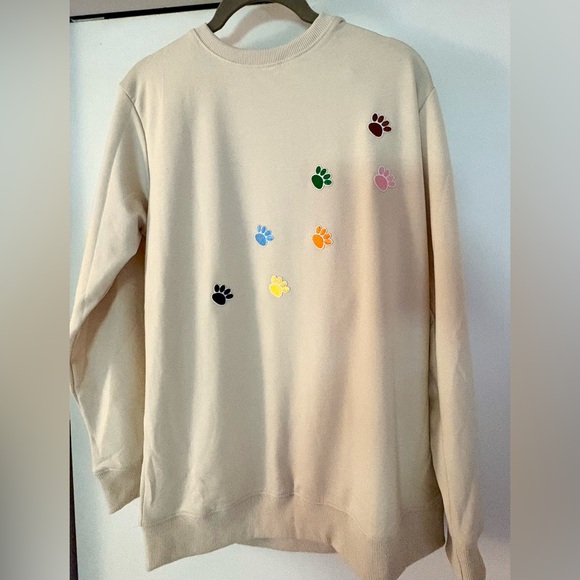 Tops - NWOT-Cream Sweatshirt with Colorful 
Embroidered mini Paw Prints